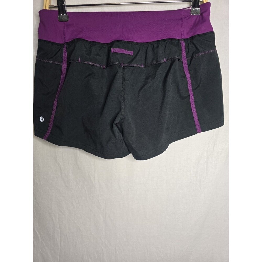 Lululemon womens size 6 Running shorts black w purple waist zip side pocket